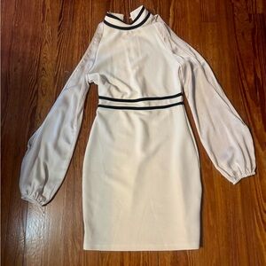 Women’s dress beige, short, long sleeve with a split in the middle of each side.